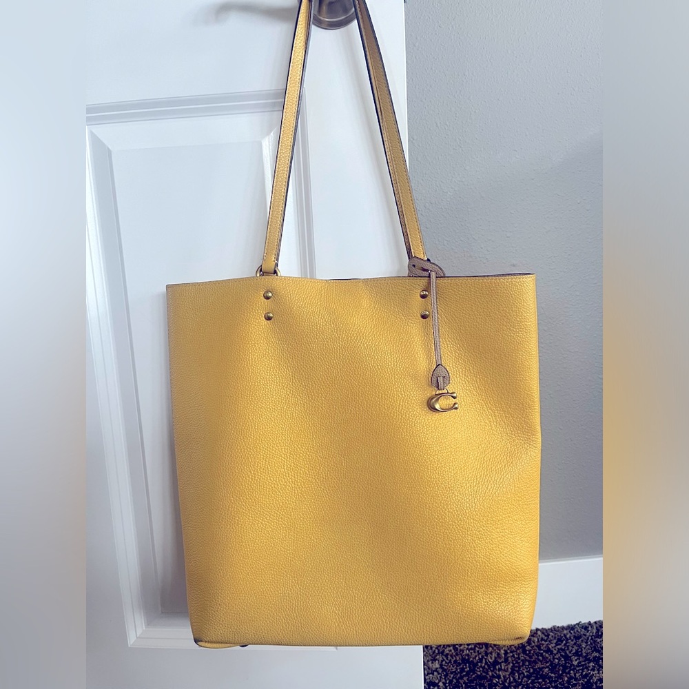 Coach slightly used purse. 14” H x 15” W x 4” depth. Bottom is a little worn.